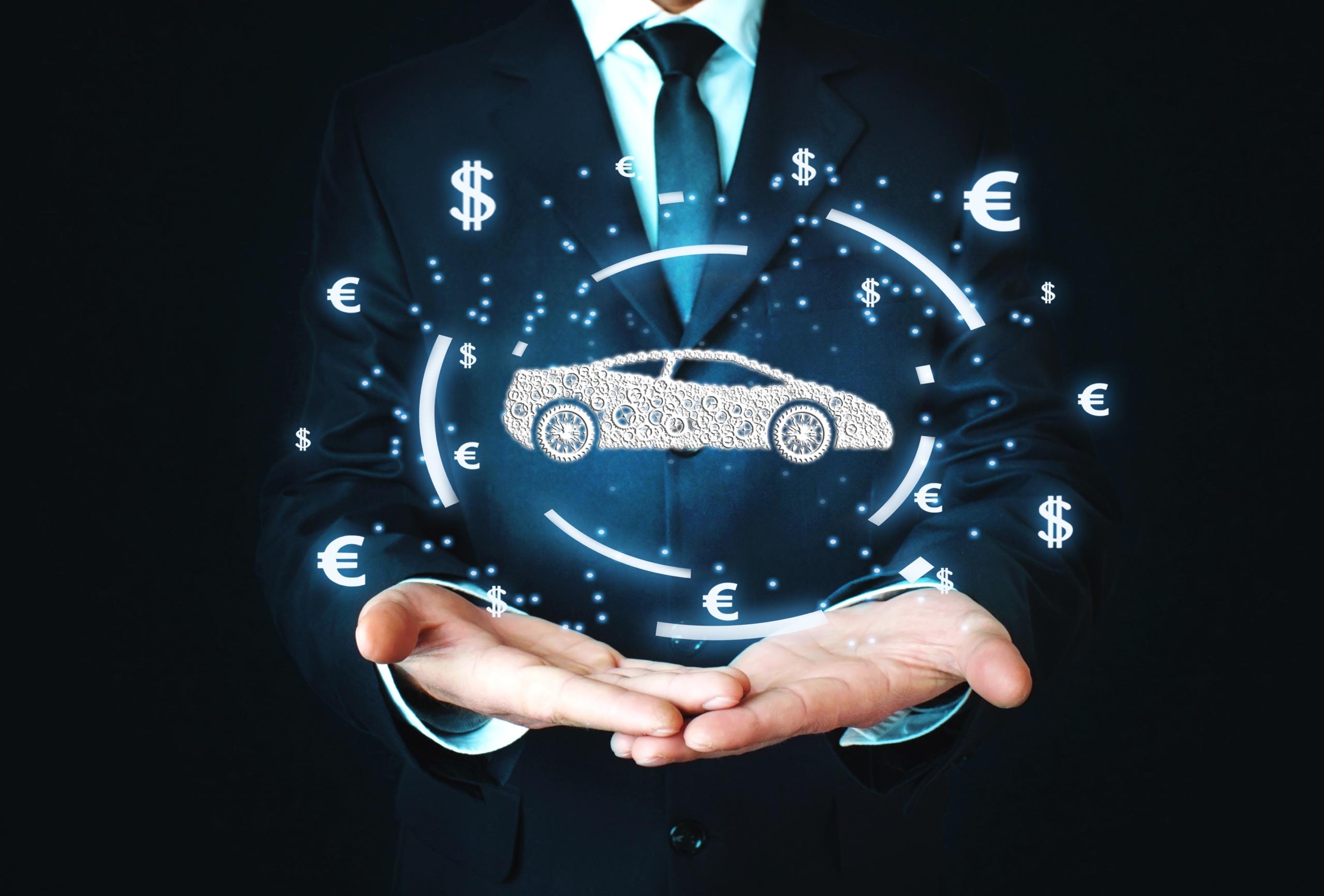 Businessman holding car and currency symbols. Concept of buy car